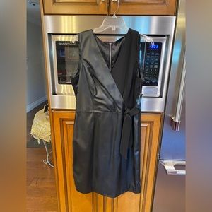 New! Black sleeveless faux wrap dress.
